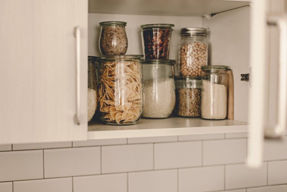 https://mindfulofthehome.com/wp-content/uploads/2021/02/pantry-with-food-in-repurposed-glass-jars-1000x667.jpg